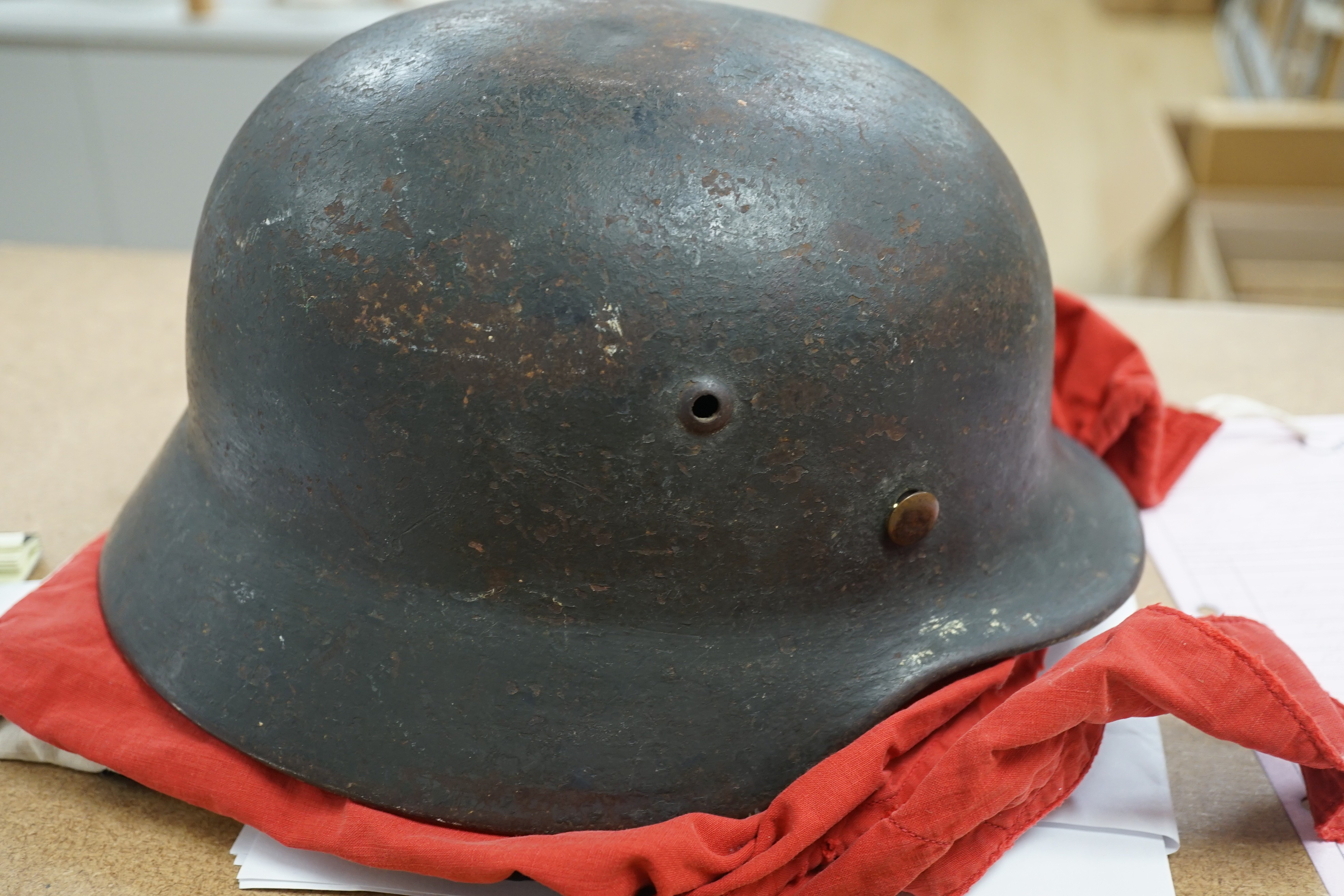 A Third Reich SS dagger, German steel helmet and a Nazi flag